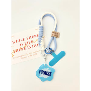 藍色 PRAISE 款手機短掛繩商品展示,淺藍與白色編織繩搭配藍色手機夾片及 PRAISE 吊牌。