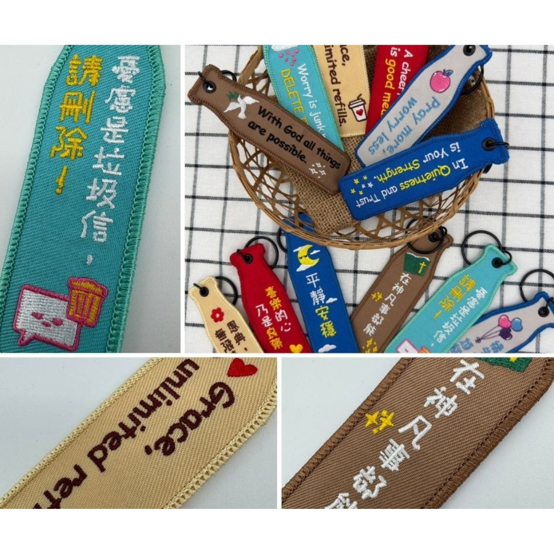 瓶安同行刺繡吊飾系列細節情境圖，展示中英文刺繡文字、圖案與多款配色，搭配黑色吊環與掛鉤設計。